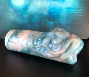 Dagon stroker from Fantasticocks, a sea creature fantasy stroker in a blue green and pale pink color