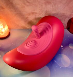 The Rider Desire with the thrusting attachment docked. Salt lamp and orange candle can be seen behind.