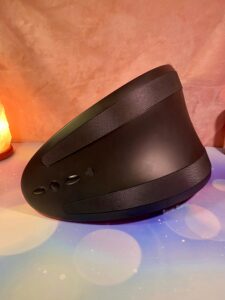 The bottom of the Rider Desire, the two grip strips can be seen, as well as the three button control panel. The silicone flap covers the charging port.