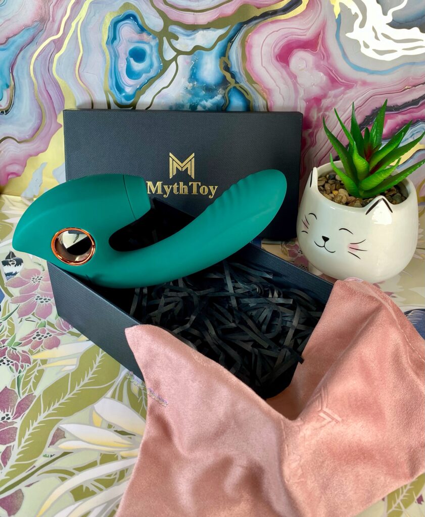 The muse from MythToy, a dual action vibrator in emerald green and gold color